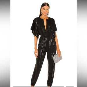 Never worn Norma kamali rectangle jog jumpsuit. Size small. New with tags